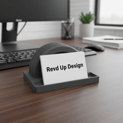 3D printed half tire business card holder with business cards on white background