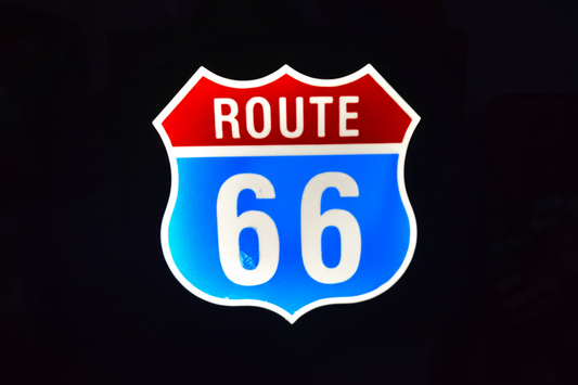 Route 66 LED lightbox sign glowing red and blue on black background